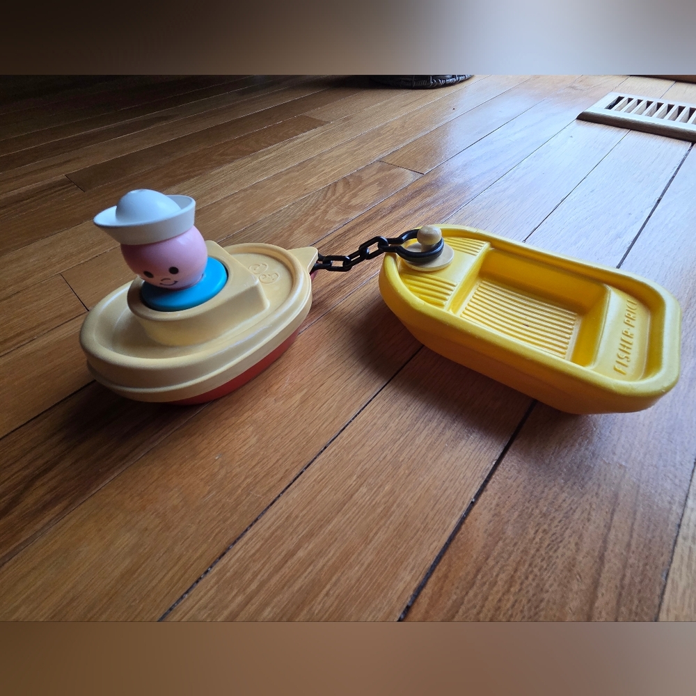 Fisher-Price Yellow Tug Boat with‎ Pink Captain and Cream Hull